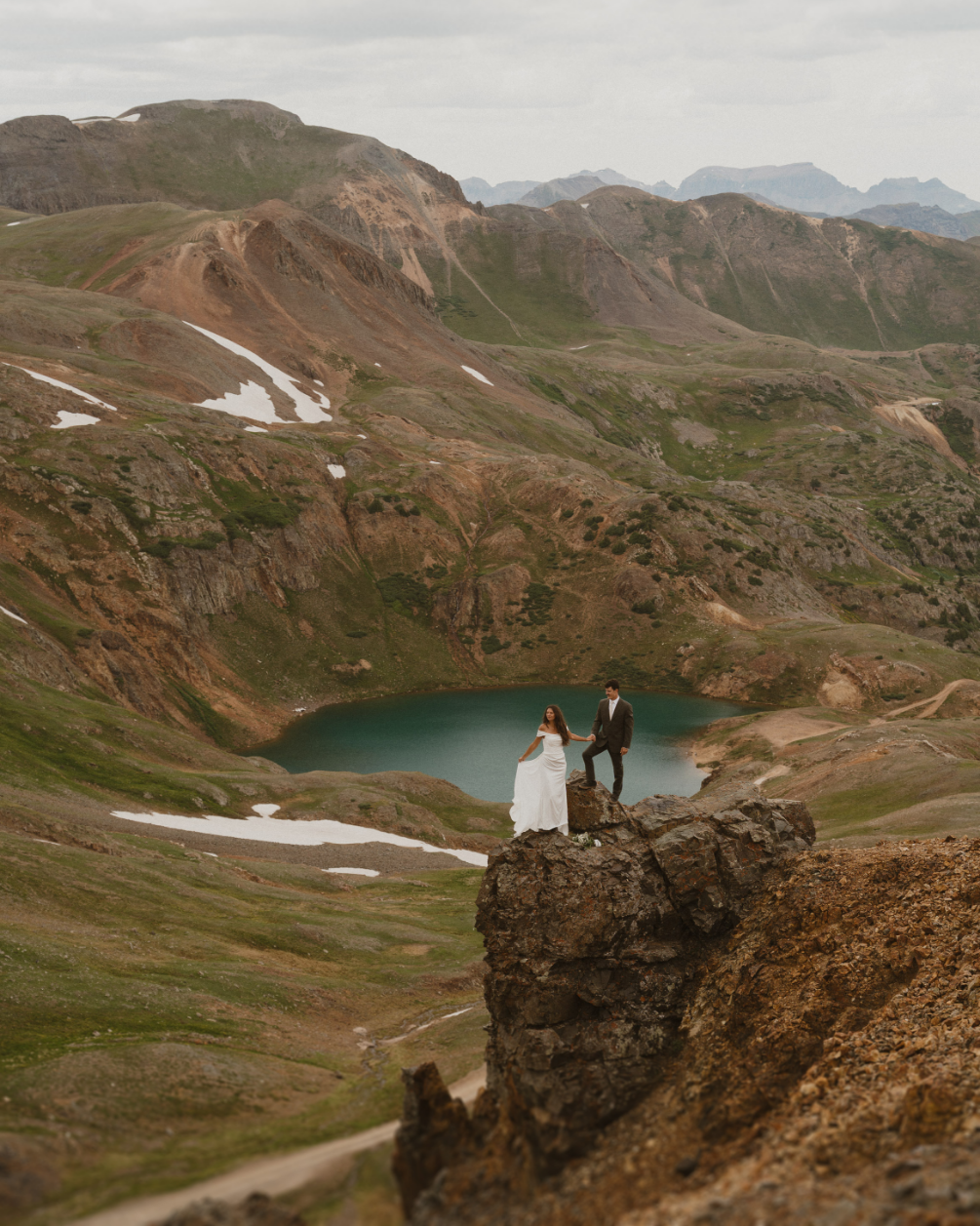 couple standing on mountain