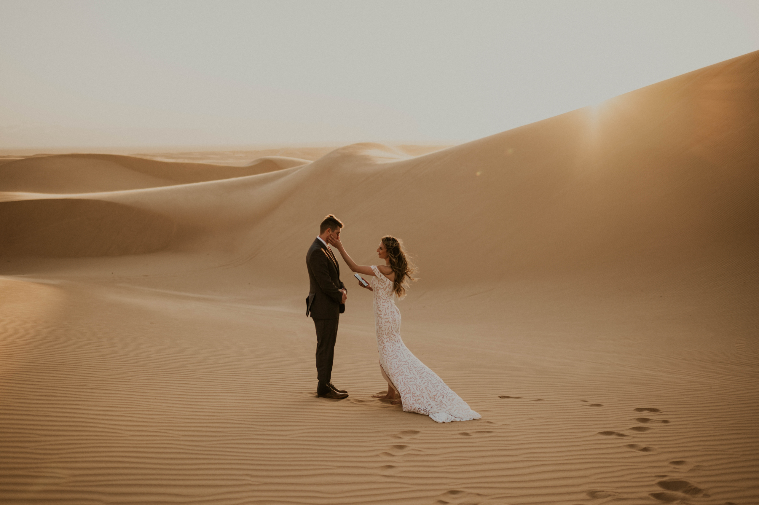 Wedding couple during ceremony at great sand dunes national park