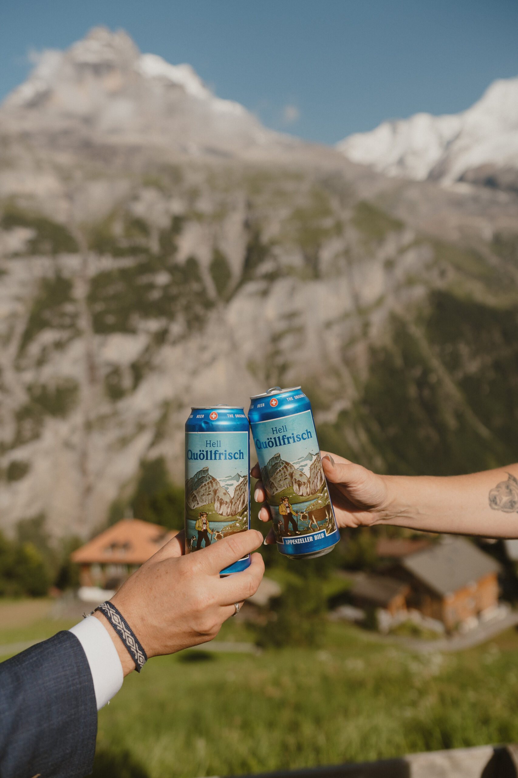 Cheers with two beers in switzerland
