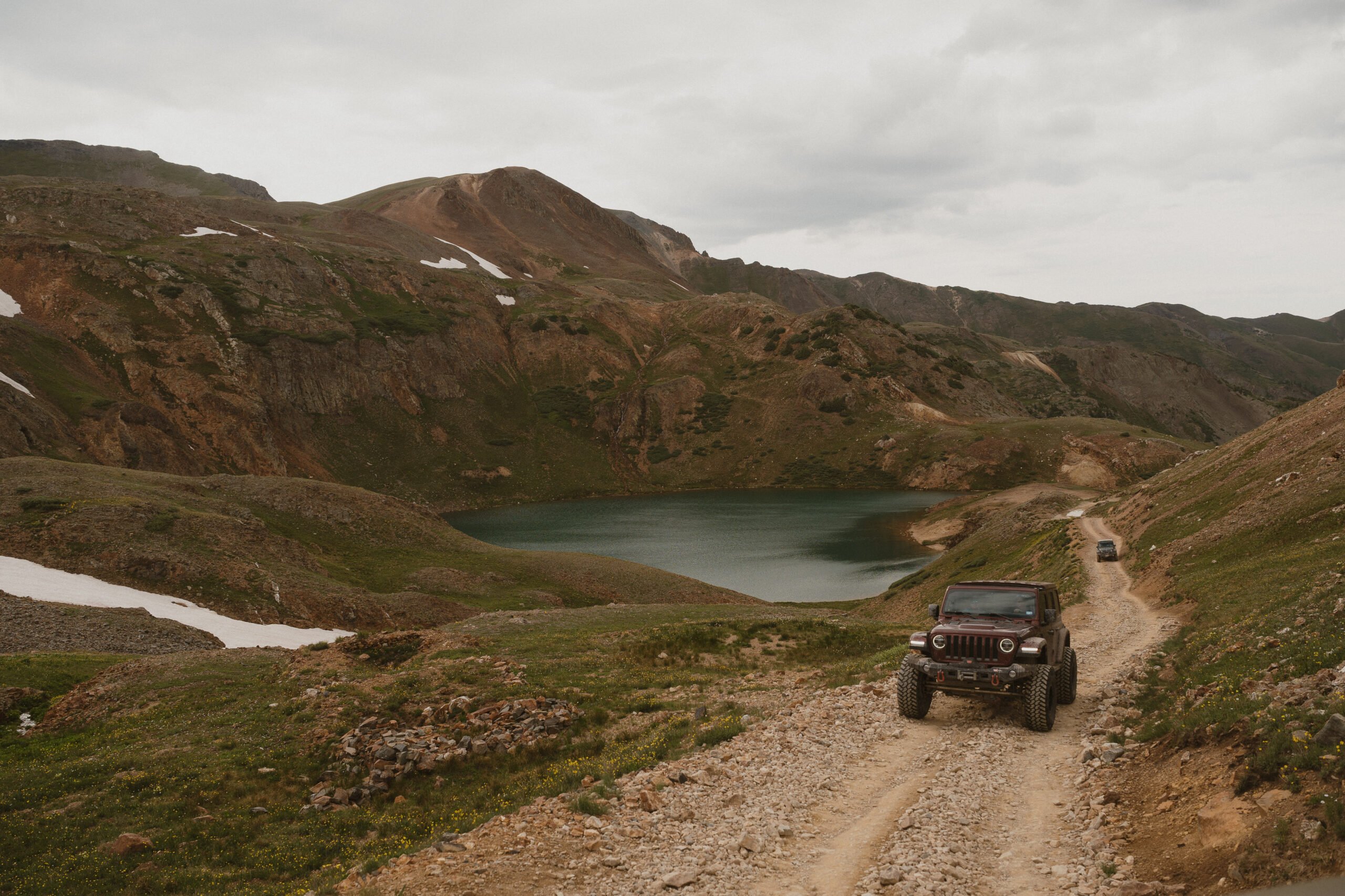 photo of jeep coming up from alpine lake como in ouray colorado