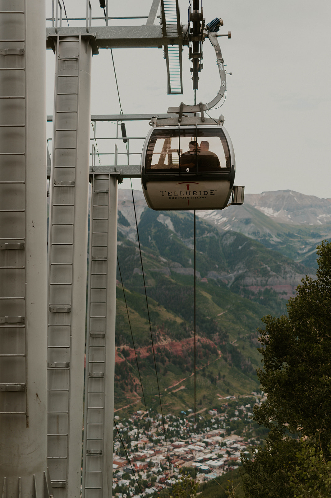 couple kissing in gondola in telluride