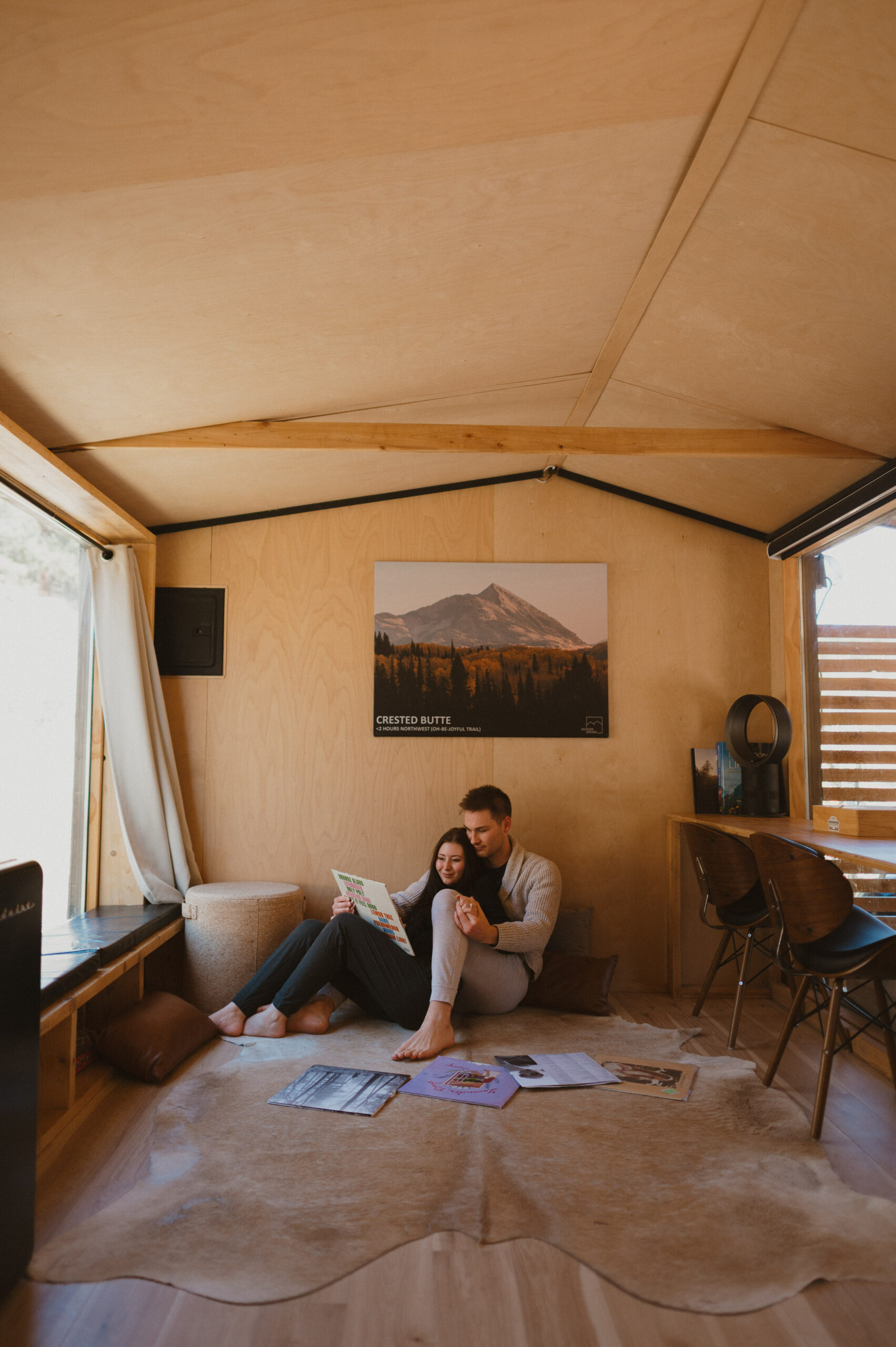 couple reading records and sitting on the floor