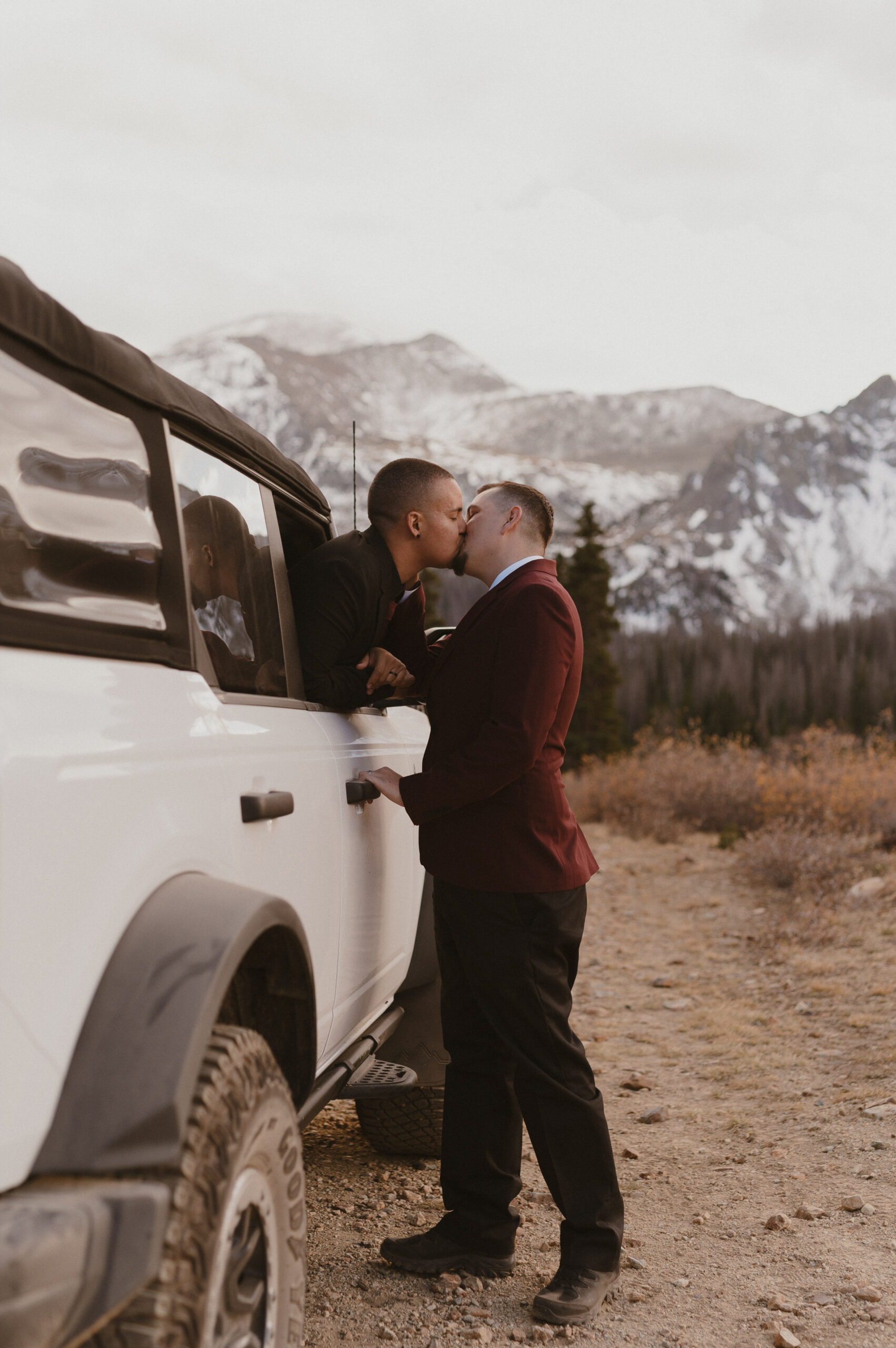 couple kissing in window of 4x4 in colorado