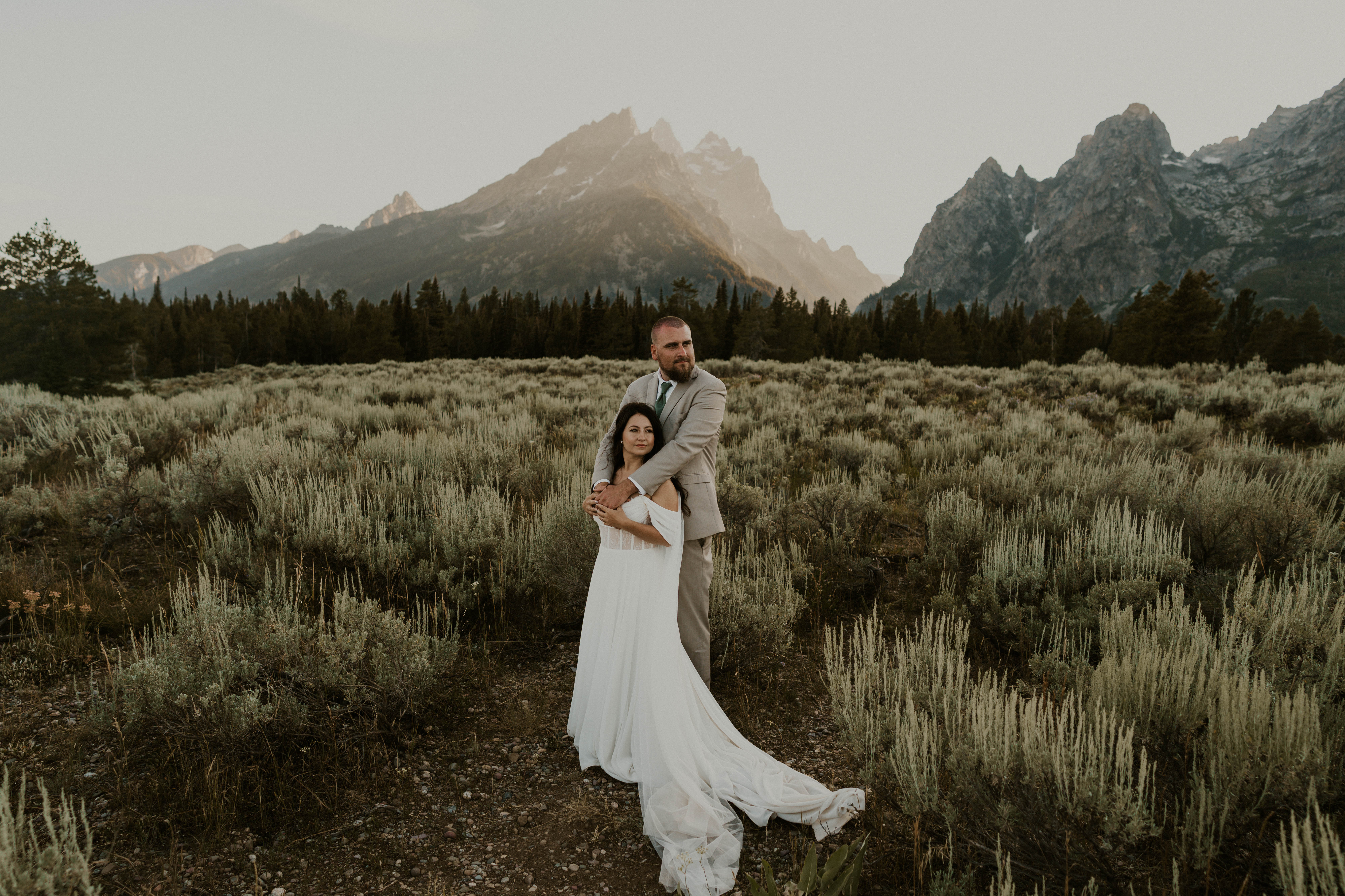 couple in field in grand teton national park