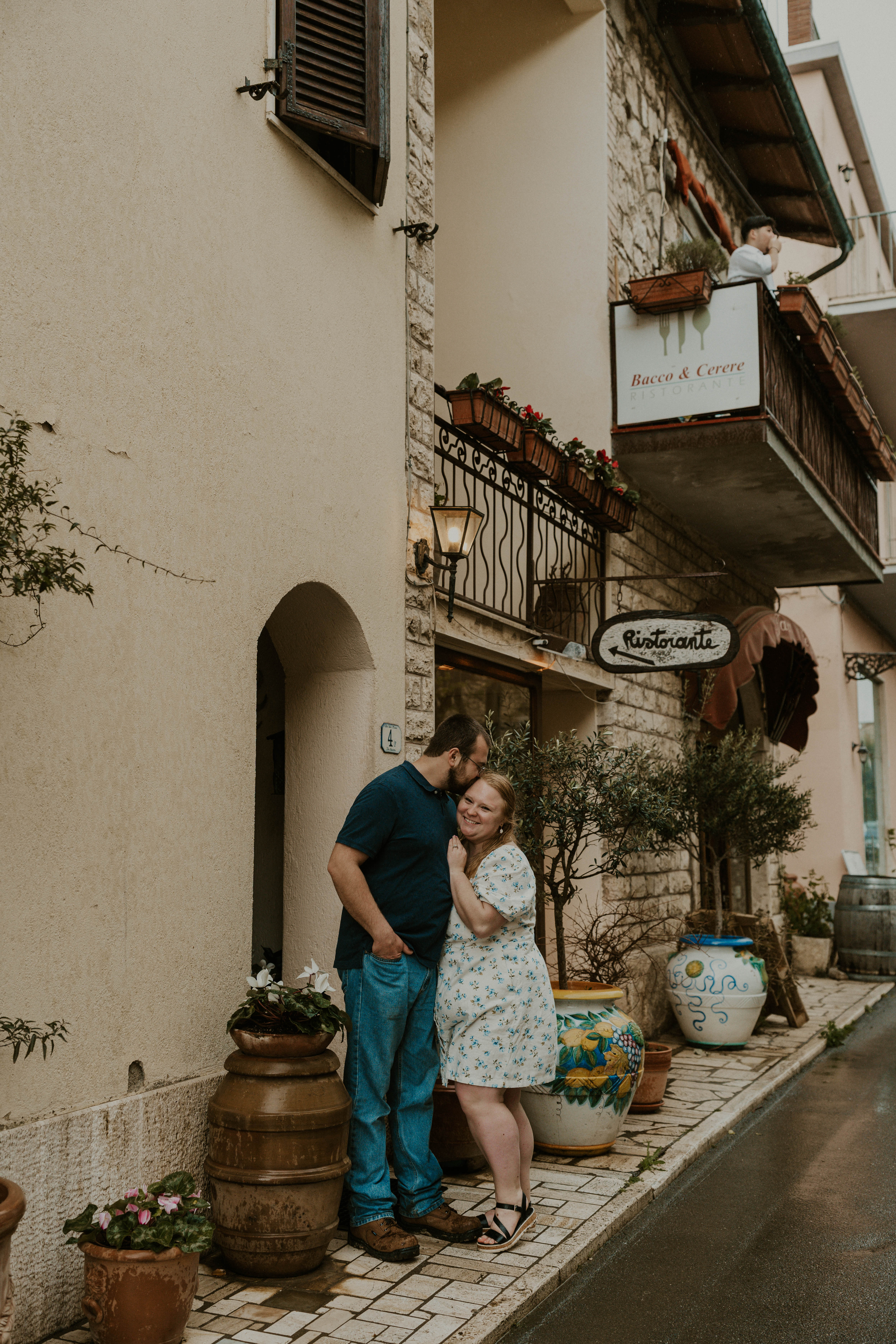 Couple standing on street in Tuscany, italy